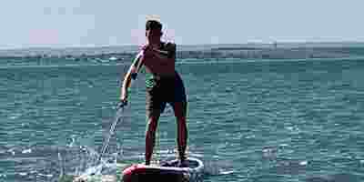Ostomate Slaide Bowden paddleboarding on the sea