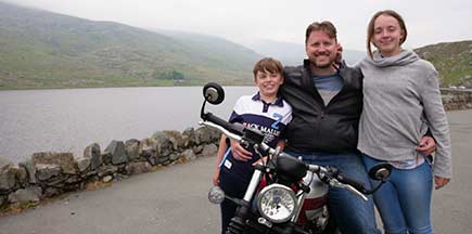 Chris and his family on a motorbike